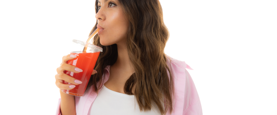 woman sipping delicious drink