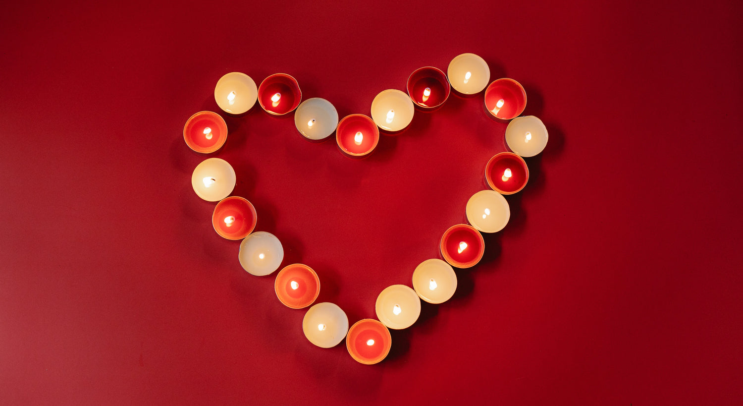burning candles in heart shape